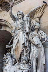 Beautiful  statue at the Paris Opera House, Palais Garnier, in Paris, France is known for its opulent Baroque style interior decor and Beaux-Arts exterior architecture.
