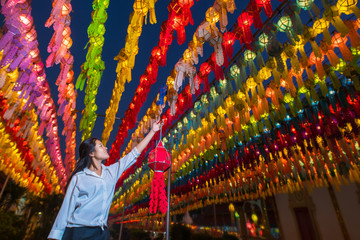 Women and Colorful Lantern Festival or Yee Peng Festival (North of Thailand new years)