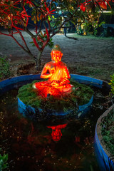 Fototapeta premium Beautiful Buddha statue in the night garden, Goa, India