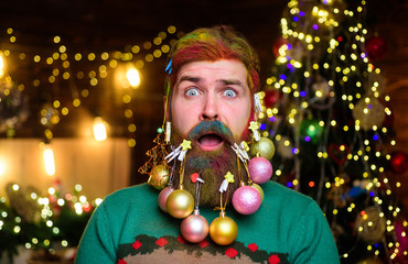 Decorated beard. New year party. Surprised Santa man with decorated beard. Bearded Santa man with decorated beard. Merry Christmas. Happy new year. Christmas beard decorations. Christmas decorations.