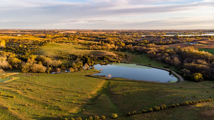 Morning over a rural countryside pond in Nebraska during autumn