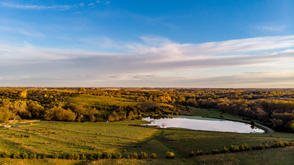 Morning over a rural countryside pond in Nebraska during autumn