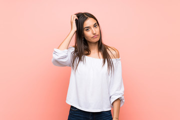 Young woman over isolated pink background with an expression of frustration and not understanding