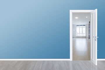 Close up of open wooden door in the empty room with copy space