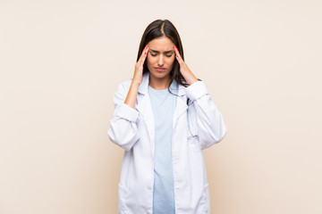 Young doctor woman over isolated background unhappy and frustrated with something. Negative facial expression