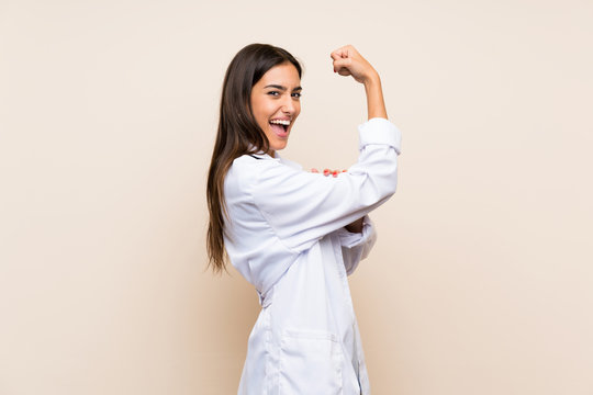 Young Doctor Woman Over Isolated Background Making Strong Gesture