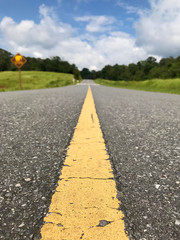 Straight road to national park, Thailand with selective focus