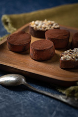 chocolate truffles on a wooden plate
