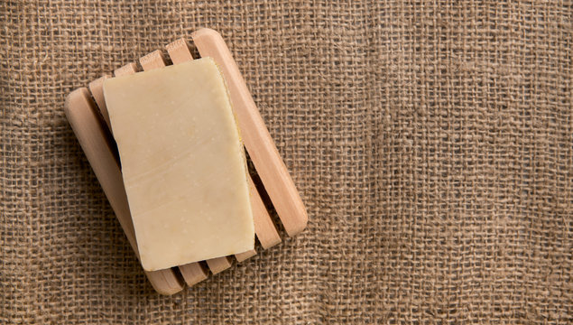 Handmade natural soap on fief canvas with copy space