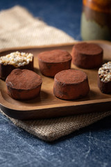 chocolate truffles on a wooden plate