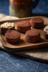 chocolate truffles on a wooden plate