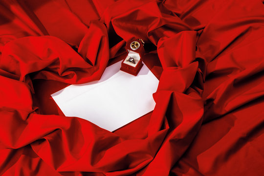 valentine card composition on a red fabric. there is always some madness in love let me be yours message. 
