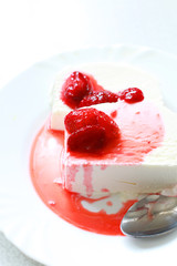 delicious ice cream on a plate with strawberry syrup