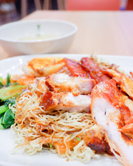 Wantan noodles, a Cantonese Chinese cuisine served dry with soy sauce and roast pork