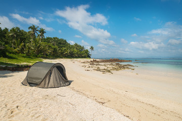 Tourist tent camping on sand beach