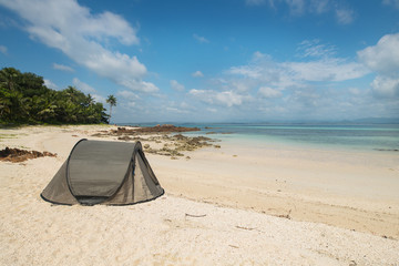 Tourist tent camping on sand beach
