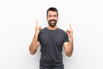 Young handsome man over isolated white background pointing up a great idea