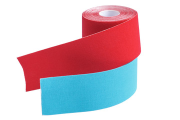 Stack of two rolls kinesiology tape for athletes isolated on white background.