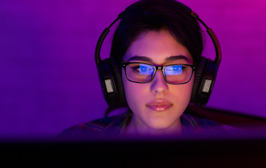 Professional gamer girl participating in eSport games tournament