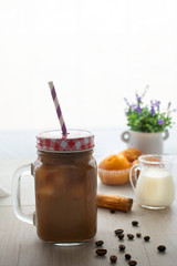 Coffee cup and cupcake and milk