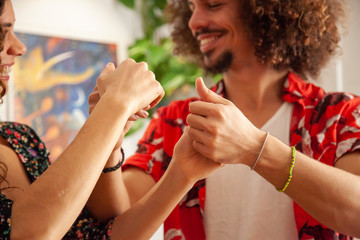 Close up of male and female hands while salsa dancing. - obrazy, fototapety, plakaty