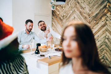 Men drinking champagne at Christmas
