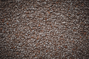 Beige and brown background of fine gravel. Small pebble stones of various shapes. Abstract background for many tasks. Landscape photo arrangement.