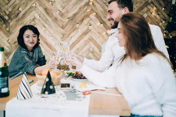 Pleased friends enjoying and celebrating Christmas