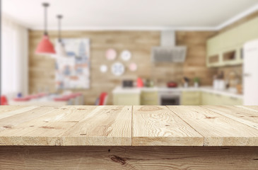 Wooden desk with blur bokeh with kitchen interior background,