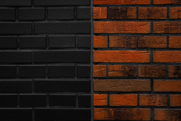 Beautiful new brick wall texture background. Half orange, red and half black bricks. Close up
