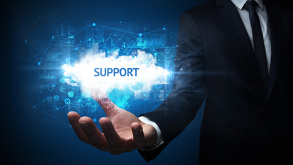Hand of Businessman holding SUPPORT inscription, successful business concept
