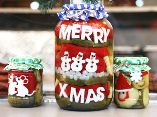 Funny jar of pickled vegetables in a hungarian christmas market as christmas present for sale