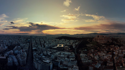 Aerial drone photo of Athens new modern Acropolis museum and urban cityscape at dusk with beautiful colours and cloudy sky, Attica, Greece