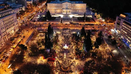 Foto op Plexiglas Aerial drone photo of illuminated festive Syntagma square featuring Greek Parliament and Christmas tree, Athens centre, Attica, Greece © aerial-drone
