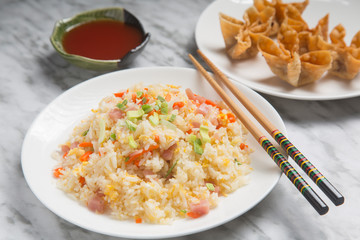 Close-up of Chinese rice three delicacies and fried wanton.