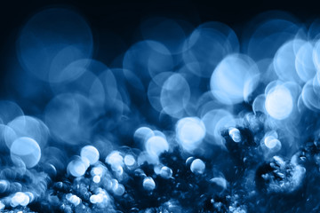 Blue bokeh. Glitter shiny sparkle abstract background. Color of the year 2020.