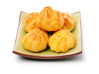 eclairs filled with fresh cream on white background
