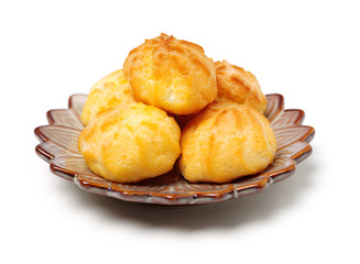 eclairs filled with fresh cream on white background