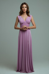 Full length tall slim luxurious elegant lush brown hair green eyes woman in lilac evening neckline...