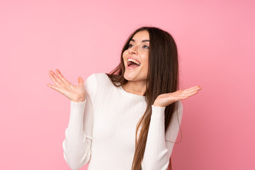 Young woman over isolated pink background with surprise facial expression