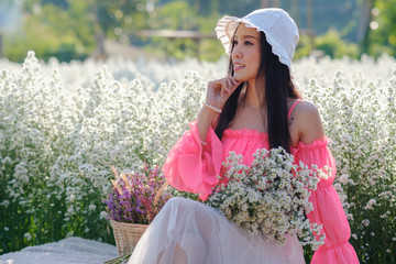 Fototapeta premium girl in a dress in field of flowers