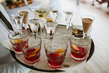 Colorful alcohol drinks in small glasses