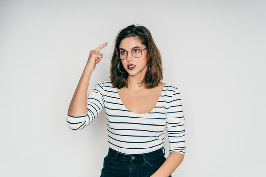 Woman showing crazy gesture looking away