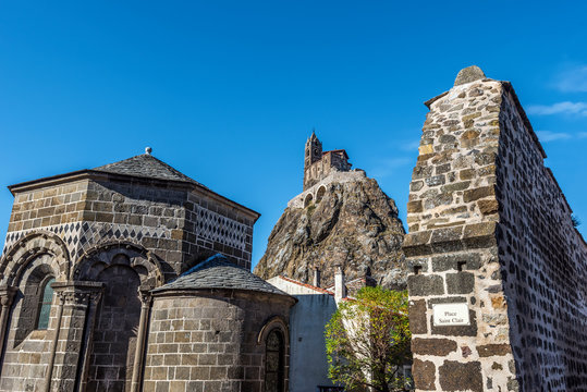 Parts of the Chapel Saint Clair d Aiguilhe and the famous Saint-Michel d Aiguilhe rock is at background. Le Puy-en-Velay in Haute-Loir department, Auvergne-Rhone-Alpes region in France.