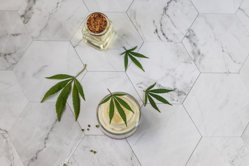 Natural cannabis cream, hemp, moisturizing CBD lotion. Cosmetic product. On a light background