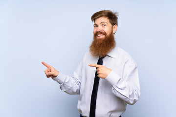 Businessman with long beard over isolated background pointing finger to the side