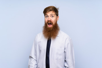 Businessman with long beard over isolated background with surprise facial expression