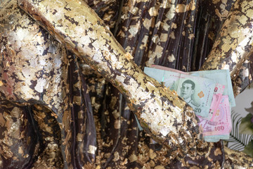 10 December 2019 Nonthaburi Thailand Buddha holding baht