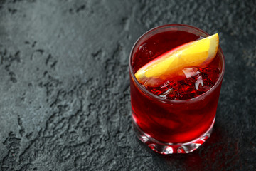 Classic Old Fashioned Negroni cocktail on rustic stone background