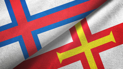 Faroe Islands and Guernsey two flags textile cloth, fabric texture